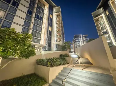 a set of stairs in front of some tall buildings at Bluewaters 5BR Panoramic Eye of Dubai Views Near JBR Beach in Dubai