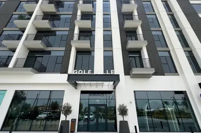 an apartment building with a sign on it at Cozy 1 - Bedroom Retreat in DHE in Dubai