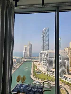a view of the ocean from a hotel window at Deluxe Marina View 2BR - Stella Maris Retreat in Dubai
