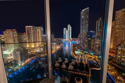 a view of a city skyline at night at Deluxe Marina View 2BR - Stella Maris Retreat in Dubai
