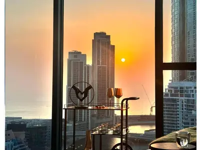 a window with a view of a city skyline at Deluxe Marina View 2BR - Stella Maris Retreat in Dubai