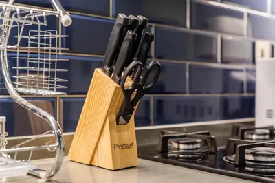 a knife block sitting on top of a kitchen counter at Canal View Studio - 10 min to Dubai Mall - MAG 318 in Dubai