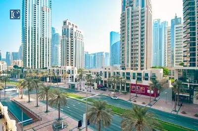 a city with palm trees and tall buildings at Luxury Escapes - Elegant 3BR Apt with 4 Balconies in 29 Blvd in Dubai
