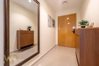 a large mirror in a hallway with a door at Marco Polo - Experience elegant living in JVC Dubai in Dubai