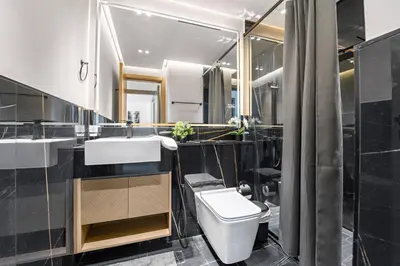 a bathroom with a toilet and a sink at Elegant 1-Bedroom Apartment in Dubai
