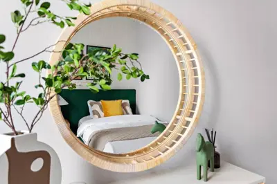 a mirror on a wall with a bed in a room at Chic 2BR Stay at Creek Horizon with Pool, Gym and Prime Dubai Location in Dubai