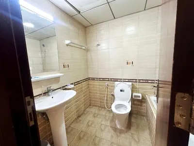 a bathroom with a toilet and a sink at The Hive Partition Room in Tecom Near Metro in Dubai