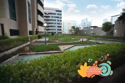 a view of a park in a city with buildings at Cove Partition Room in Tecom Near Internet City Metro in Dubai