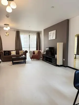 a living room with a couch and a tv at Luxury Studio in Murjan 2, JBR in Dubai