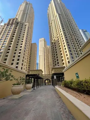 a walkway in a city with tall buildings at Luxury Studio in Murjan 2, JBR in Dubai