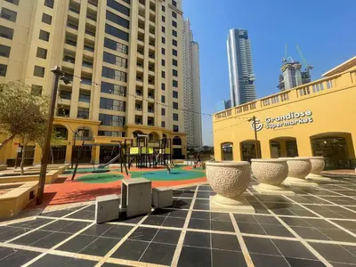 a playground in the middle of a city with tall buildings at Luxury Studio in Murjan 2, JBR in Dubai