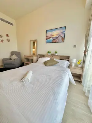 a bedroom with a large white bed in a room at Cozy Retreat, Relax and Explore in Dubai