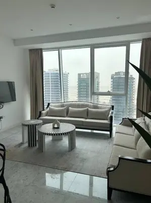 a living room with a couch and a table at 1BDR-furnished apartment, Business Bay, CANAL VIEW in Dubai
