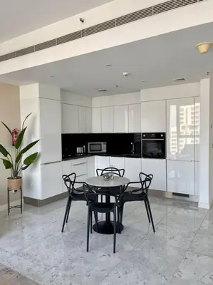 a dining room with a table and chairs in a kitchen at 1BDR-furnished apartment, Business Bay, CANAL VIEW in Dubai