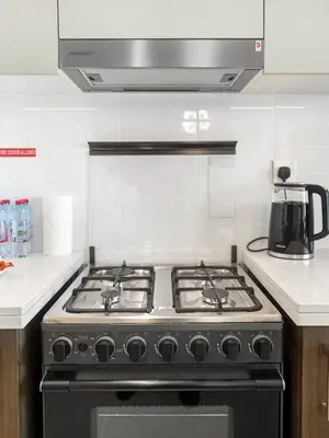 a stove top oven in a kitchen at Brand New Downtown unit! Bvlgari World Island View in Dubai