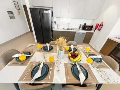 a kitchen with a table with fruit on it at Brand New Downtown unit! Bvlgari World Island View in Dubai