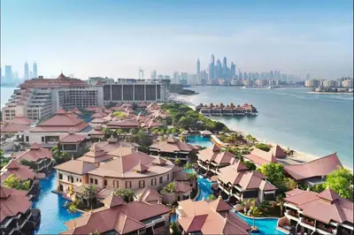 an aerial view of a city with buildings and the water at AWS Holiday Homes - Tranquil Stay at the Palm in Dubai