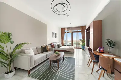 a living room with a couch and a table at Silkhaus Ocean View in Palm Views Holiday Vibes in Dubai