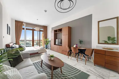 a living room with a couch and a table at Silkhaus Ocean View in Palm Views Holiday Vibes in Dubai