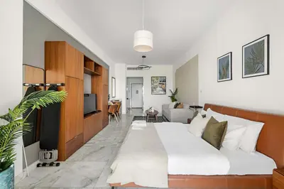 a bedroom with a large bed and a living room at Silkhaus Ocean View in Palm Views Holiday Vibes in Dubai
