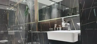 a bathroom with a sink and a mirror at Modern 1br In Jvc Balcony, Pool & Free Parking in Dubai