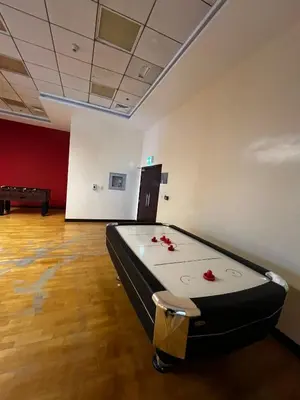 a room with a pool table in the middle of it at Elite Residence Appartment 4007 in Dubai
