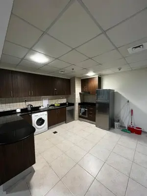 a large kitchen with a washer and dryer in it at Elite Residence Appartment 4007 in Dubai
