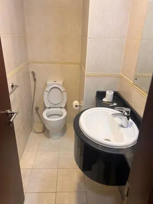 a bathroom with a toilet and a sink at Elite Residence Appartment 4007 in Dubai