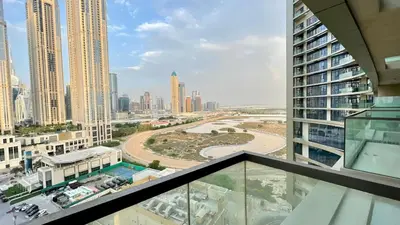 a view of a city from the balcony of a building at Appartement spacieux de luxe à 5mn du Burj Khalifa in Dubai