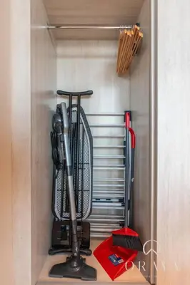 a closet with a broom and other tools in it at Luxurious Studio In Seven Palm Hotel & Apartments in Dubai