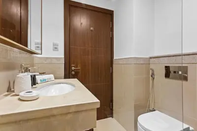 a bathroom with a sink and a toilet at Bright One BDR close to Burj Khalifa & Dubai Mall in Dubai