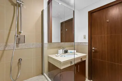 a bathroom with a sink and a shower at Bright One BDR close to Burj Khalifa & Dubai Mall in Dubai