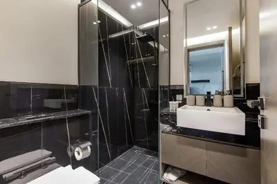 a bathroom with a sink and a mirror at Sophisticated Binghatti Canal in Dubai