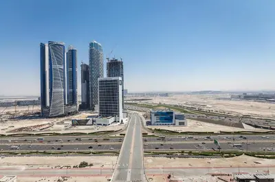 a highway in front of a city with tall buildings at Sophisticated Binghatti Canal in Dubai