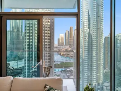 a living room with a view of a city at 2BR-Downtown Apartment- 10 Min Walk to Dubai Mall in Dubai