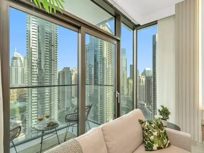 a living room with a view of a city at 2BR-Downtown Apartment- 10 Min Walk to Dubai Mall in Dubai