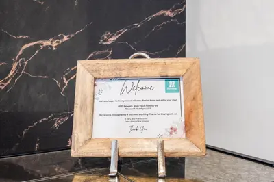 a picture of a menu in a wooden frame at Cosmic Sky Suite High floor 1BR- Dubai Mall Access by Maxx Value Homes in Dubai