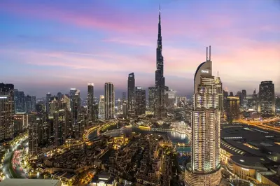 a view of a large city at night at Cosmic Sky Suite High floor 1BR- Dubai Mall Access by Maxx Value Homes in Dubai