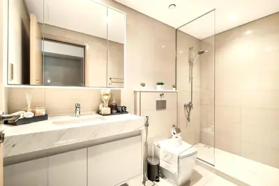 a bathroom with a toilet and a sink and a shower at Cosmic Sky Suite High floor 1BR- Dubai Mall Access by Maxx Value Homes in Dubai