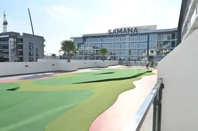 a golf course in front of a building at Studio entièrement meublé in Dubai