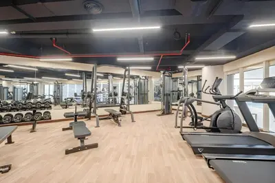 a gym with cardio equipment and treadmills at Extra Spacious Home with Stunning Marina Views in Dubai