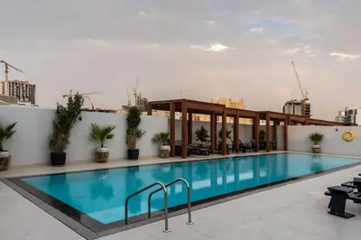 a swimming pool on the roof of a building at Waves - Luxury Meets Comfort, Modern 1BR in JVCs Luma22 in Dubai