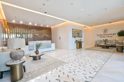 a lobby of a hotel with a waiting room at Chic Retreat 1BR in District One Meydan in Dubai