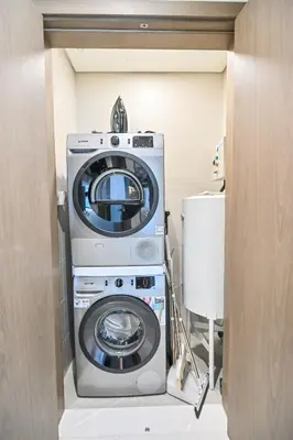 a washer and dryer in a room at Magnificent 2BR in District One Meydan in Dubai