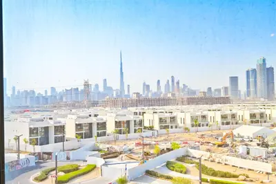 a view of a city skyline with buildings at 1BR Escape by the Lagoon in District One Meydan in Dubai