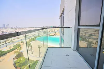 a view from the balcony of a building with a pool at Spacious 1BR with Burj Khalifa View in District One Meydan in Dubai