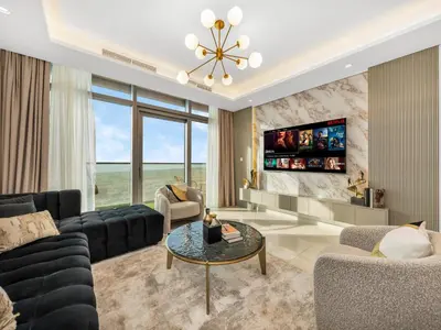 a living room with a couch and a table at Luxury Apartments at Paramount Midtown by Dale Lee in Dubai