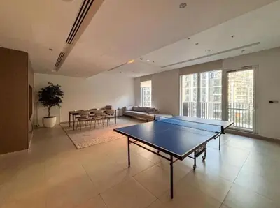 a large room with a ping pong table in it at Homes Beyond I 2 BR Apartment with Panoramic Creek View in Dubai