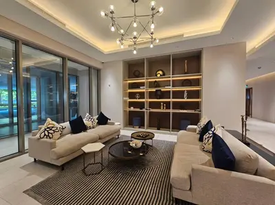 a living room with two couches and a chandelier at Fully Furnished 2 Bed in Sobha Creek Vista Reserve, Hosted by Desert City Stays in Dubai
