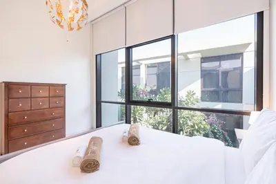 a pair of shoes sitting on a table in a room at Gorgeous 3BR Townhouse with Private Garden in Dubai